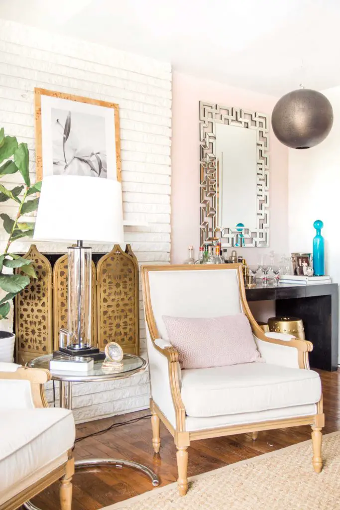 Behr Stolen Kiss, a soft and light blush pink paint color in a living room by Kevin O'Gara #blushpink #pinkwalls #pinkpaint #blushpaint #behrpaint #stolenkiss #behrstolenkiss #paintingideas #pinkpaintcolors #interiordesign
