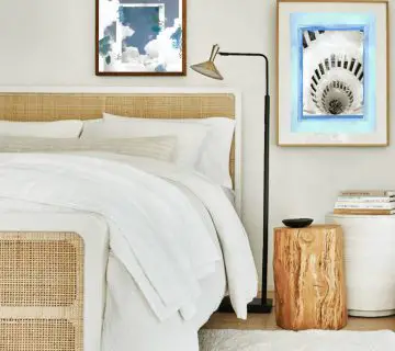 Blue and white collage art prints by Kevin Francis Design in a bedroom design with wicker bed #artprint #artwork #wallart