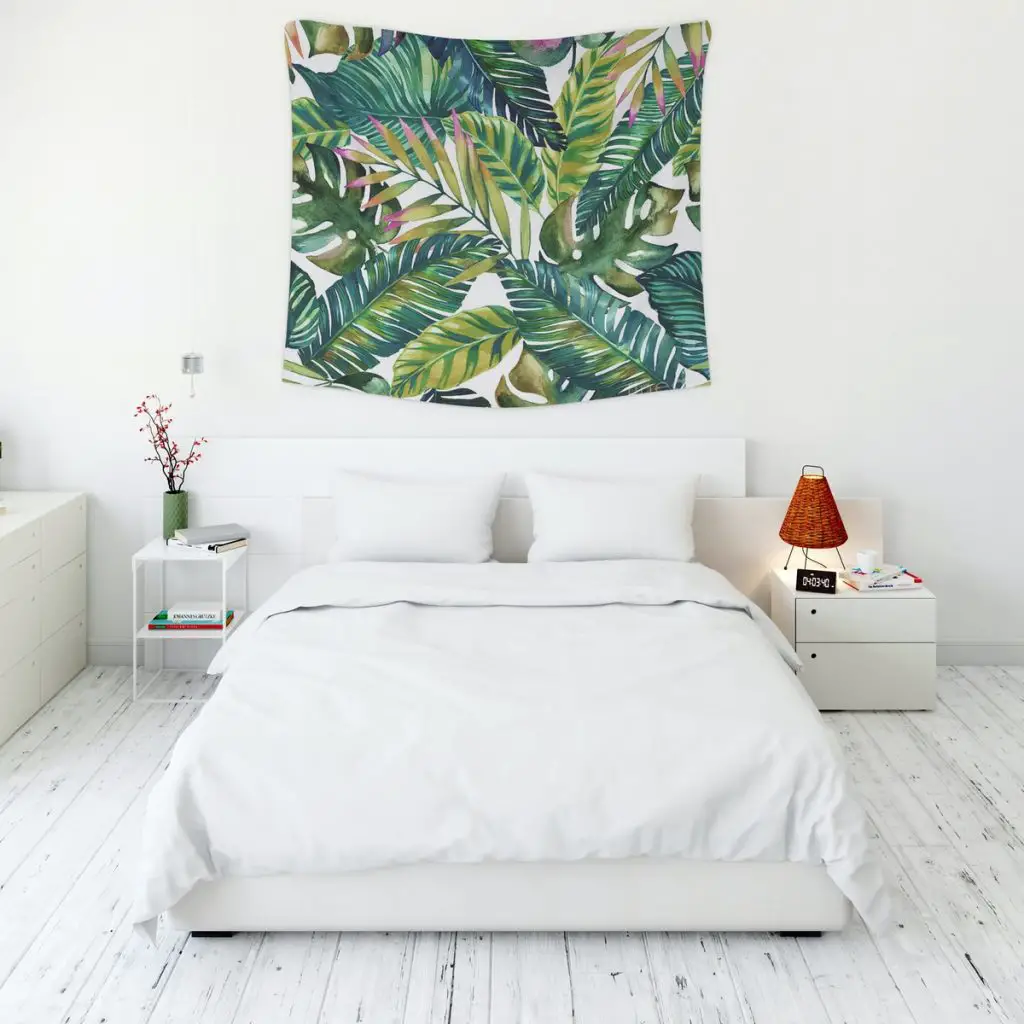 Bedroom with tropical leaves tapestry.