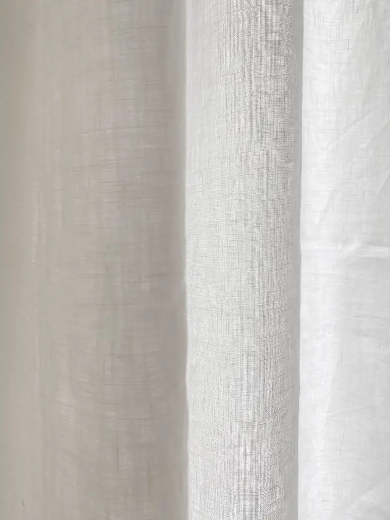 Custom tall sheer white linen curtains for two-story window living room on Thou Swell #curtains #drapery #linen #livingroom #livingroomdesign #livingroomdecor #homedecorideas