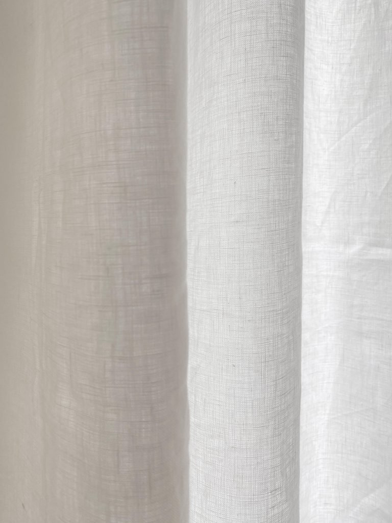 Custom tall sheer white linen curtains for two-story window living room on Thou Swell #curtains #drapery #linen #livingroom #livingroomdesign #livingroomdecor #homedecorideas