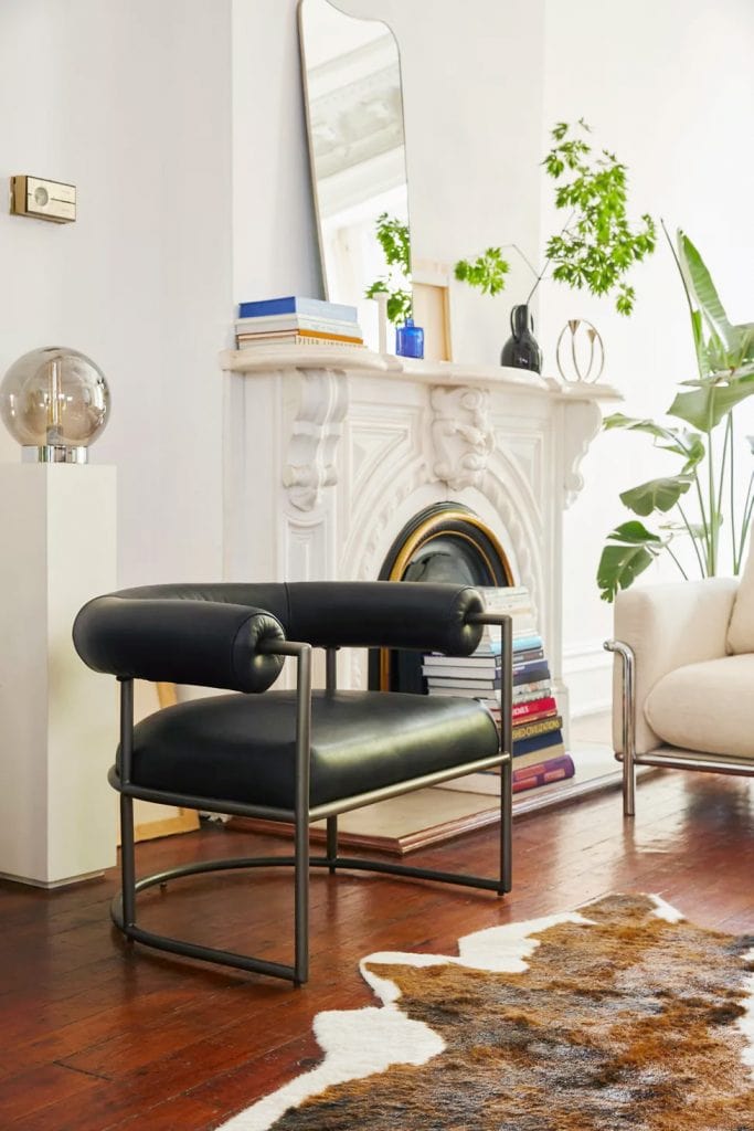 Pied-a-terre furniture collection by Urban Outfitters home with black tube leather armchair on Thou Swell 