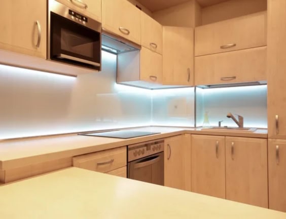 A kitchen with beautiful lighting design