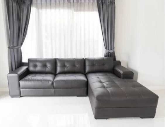 A black functional sofa bed for a small apartment