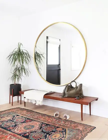 tiny living room with a large mirror
