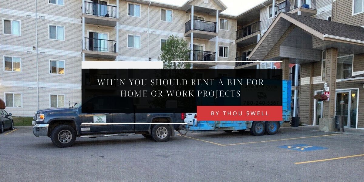 When You Should Rent a Bin for Home or Work Projects 3 A Bye Bye Junk truck tows a blue dumpster to an apartment complex for a moving cleanup project.